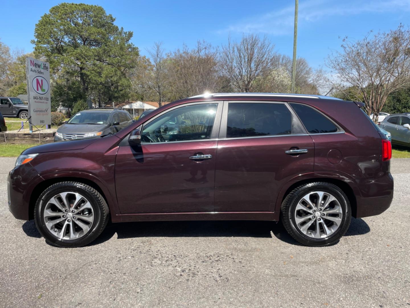 2015 PLUM KIA SORENTO SX (5XYKW4A77FG) with an 3.3L engine, Automatic transmission, located at 5103 Dorchester Rd., Charleston, SC, 29418-5607, (843) 767-1122, 36.245171, -115.228050 - Local Trade-in with Leather, Panoramic Sunroof, Navigation, Backup Camera, CD/AUX/Sat/Bluetooth, Dual Climate Control, Power Everything (windows, locks, seats, mirrors), Heated/Cooled/Memory Seating, Power Liftgate, Convenient Third Row, Push Button Start, Keyless Entry, Alloy Wheels. Certified One - Photo#3